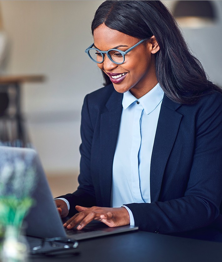 businesswoman types at her computer